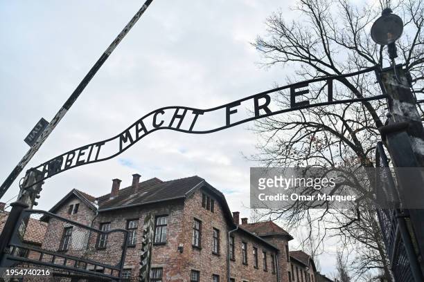 The iconic entrance gate of the former Auschwitz concentration camp that reads 'Arbeit Macht Frei' is pictured on January 23, 2024 in Oswiecim,...