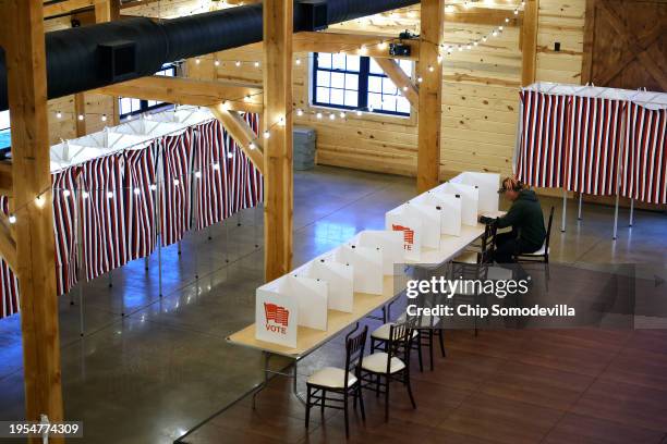 Voters cast their ballots in the New Hampshire presidential primary election at The Barn at Bull Meadow on January 23, 2024 in Concord, New...