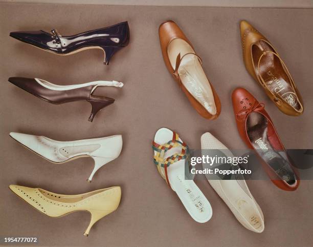 Posed studio shot from above of a selection of summer shoes for women, including stiletto heels, kitten heels, Mary Janes and strappy mules, London,...