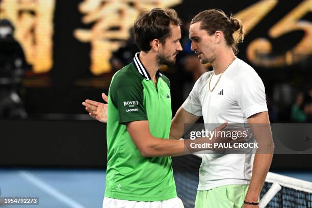 Russia's Daniil Medvedev embraces Germany's Alexander Zverev after their men's singles semi-final match on day 13 of the Australian Open tennis...