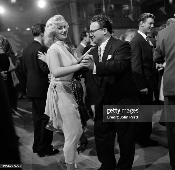 Actor and comedian Harry Secombe dancing with model Sabrina during a BBC Television Tea Party held at the Television Centre in White City, London,...