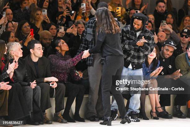 Designer Virginie Viard acknowledges the applause of Naomi Campbell and Kendrick Lamar after the Chanel Haute Couture Spring/Summer 2024 show as part...