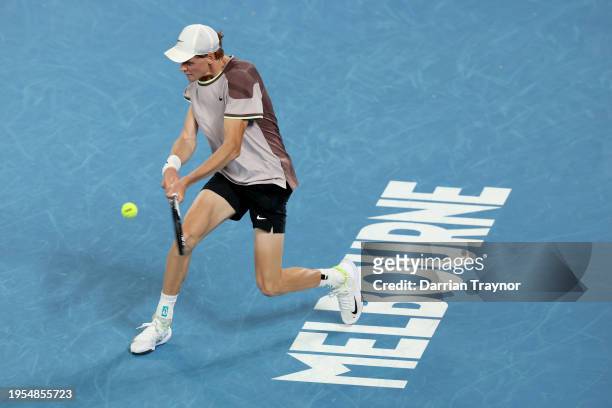 Jannik Sinner of Italy plays a backhand in their quarterfinals singles match against Andrey Rublev during the 2024 Australian Open at Melbourne Park...