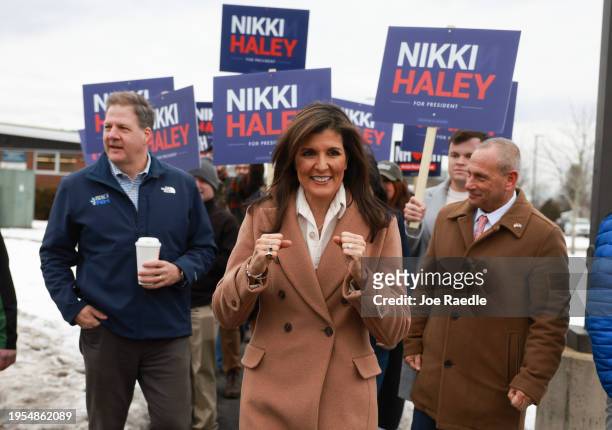 Republican presidential candidate, former U.N. Ambassador Nikki Haley is joined by New Hampshire Gov. Chris Sununu as they visit a polling location...
