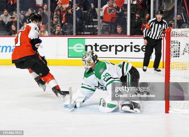 Scott Laughton of the Philadelphia Flyers skates the puck in for a third period penalty shot against Jake Oettinger of the Dallas Stars at the Wells...