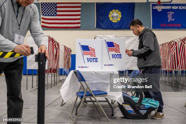 Jonathan Kipp prepares to cast his ballot in the New Hampshire Primary at Londonderry High School on January 23, 2024 in Londonderry, New Hampshire....