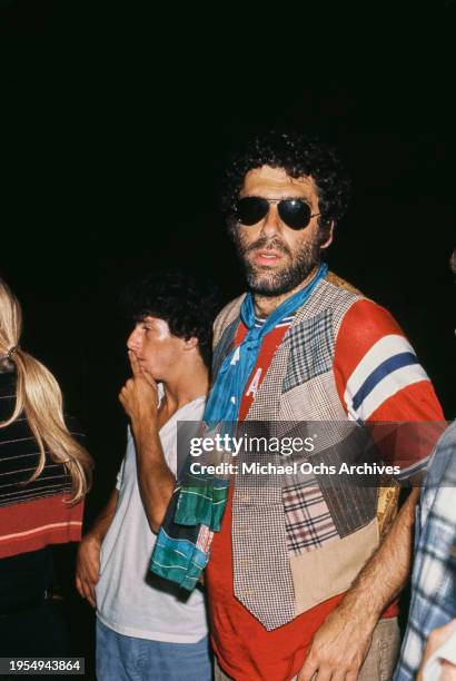 American actor Elliott Gould and American actress and producer Karen Lamm attend an event, US, circa 1976.