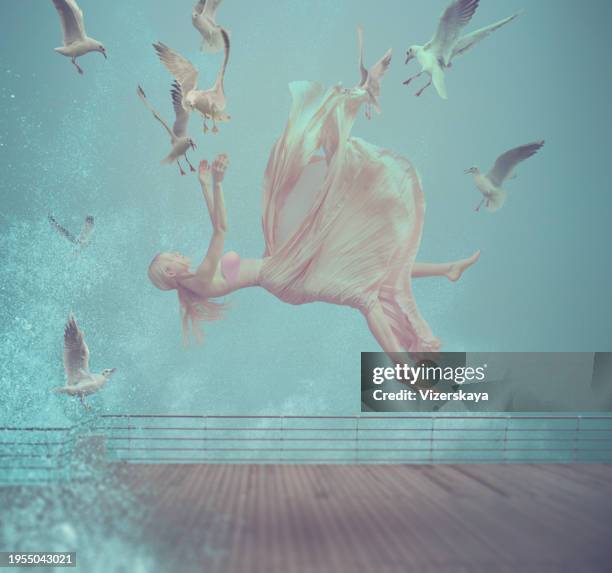 young woman flying in the air with flying seagulls - air force 個照片及圖片檔