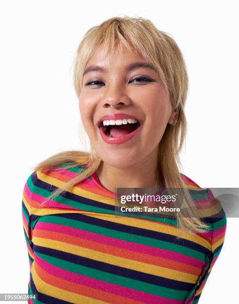 young woman pulling laughing and smiling - mullet haircut stock pictures, royalty-free photos & images