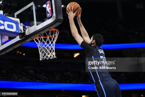 Goga Bitadze of the Orlando Magic dunks the all against the Cleveland Cavaliers during the fourth quarter at Kia Center on January 22, 2024 in...
