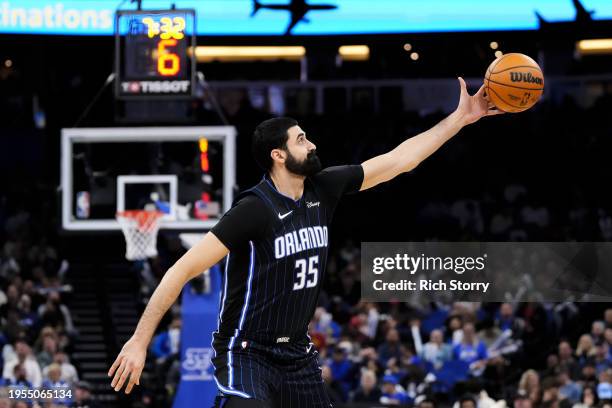 Goga Bitadze of the Orlando Magic catches a pass against the Cleveland Cavaliers during the fourth quarter at Kia Center on January 22, 2024 in...