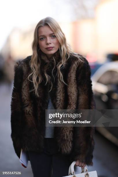 Charly Sturm seen wearing a brown fake fur jacket, a black blazer, grey pullover, dark grey jeans pants and a white Lady Dior handbag outside...