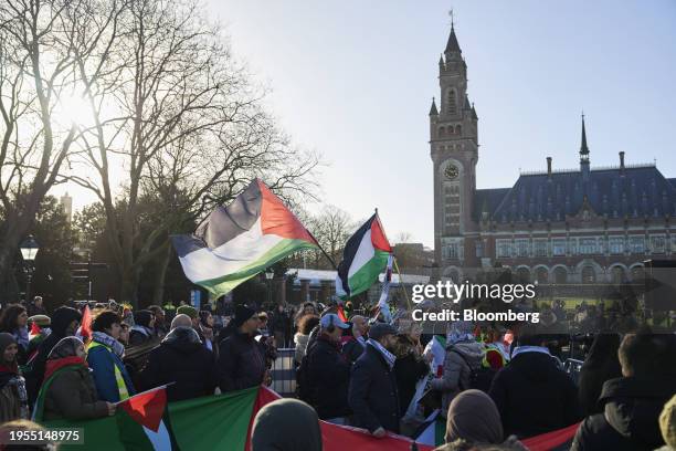 Pro-Palestinian protesters outside the International Court of Justice during the court ruling in The Hague, Netherlands, on Friday, Jan. 26, 2024. At...