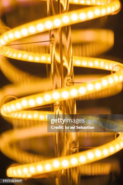 close-up shot of led filaments of a retro style light bulb. - gloeidraad stockfoto's en -beelden