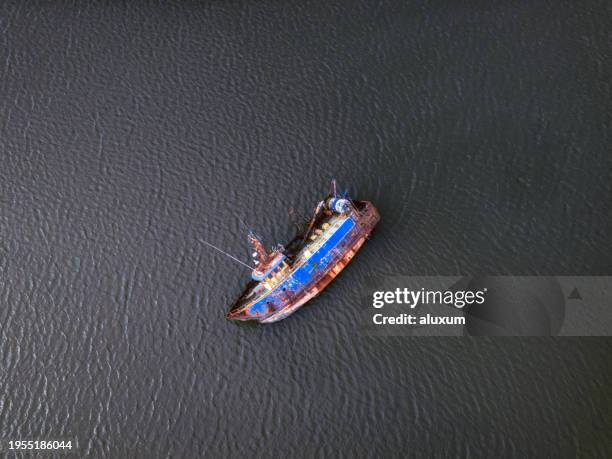 old fisherboat shipwreck at baltimore bay ireland - ship hull stock pictures, royalty-free photos & images