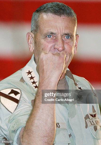 General Tommy Franks is seen pumping his fist as he makes a speech to assembled troops at CENTCOM Headquarters on April 28, 2003 in camp As Sayliyah...