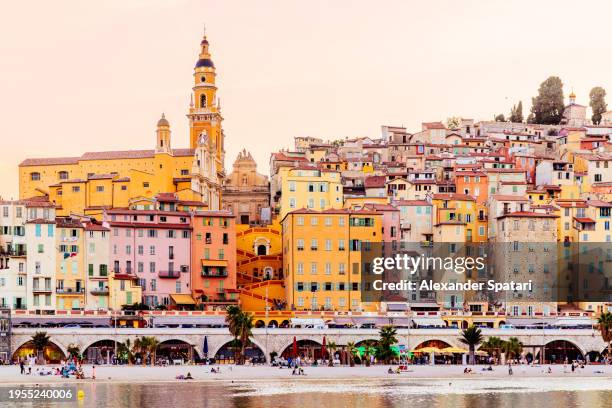 multi-coloured vibrant houses of menton skyline at sunset, french riviera, france - menton stock pictures, royalty-free photos & images