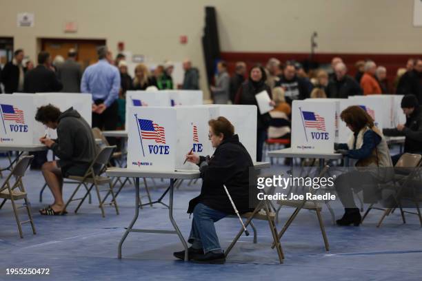 Voters fill out their ballots at a polling location at Bedford High School on January 23, 2024 in Bedford, New Hampshire. Voters headed to the polls...