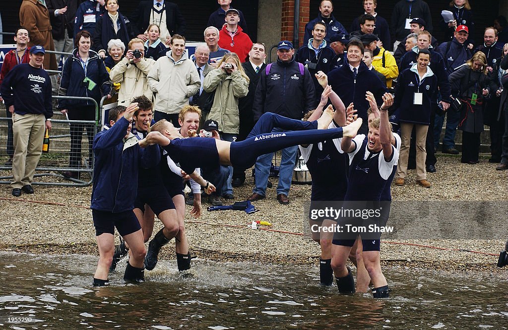The victorious Oxford Cox Acer Nethercott is thrown in the Thames in traditional manner