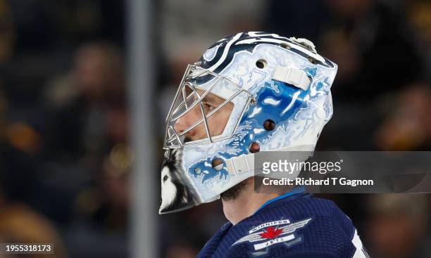 Connor Hellebuyck of the Winnipeg Jets tends goal during the third period against the Boston Bruins at the TD Garden on January 22, 2024 in Boston,...