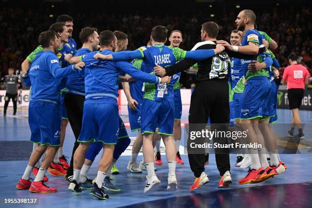 Players of Slovenia celebrate victory after the Men's EHF Euro 2024 main round match between Slovenia and Denmark at Barclays Arena on January 23,...