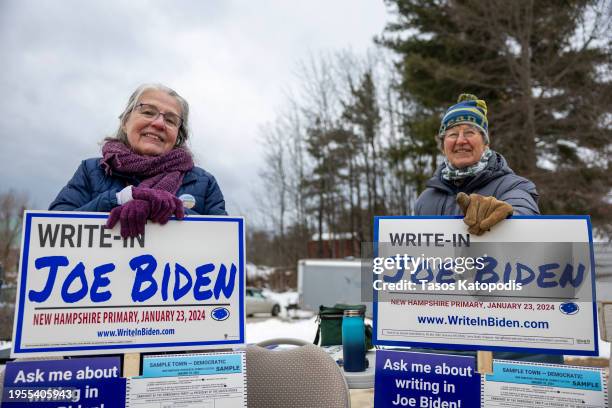 Supporters of President Joe Biden greet voters on January 23, 2024 in Loudon, New Hampshire. With Florida Governor Ron DeSantis dropping out of the...