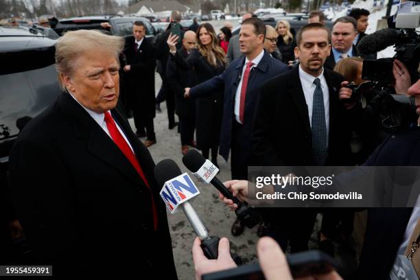 Republican presidential candidate, former U.S. President Donald Trump talks to reporters while visiting the polling site at Londonderry High School...
