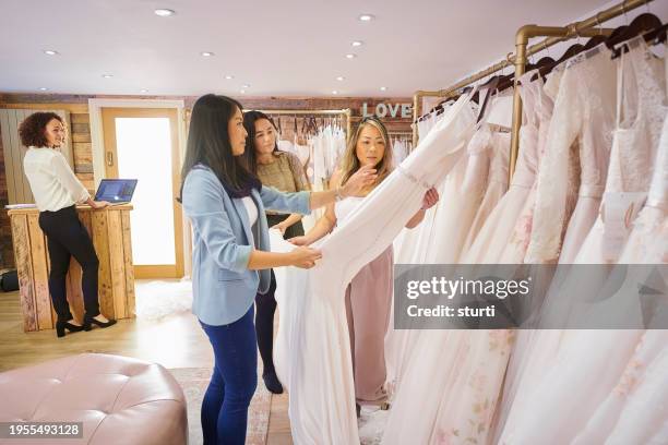 wedding dress shopping - bridal shop stock pictures, royalty-free photos & images