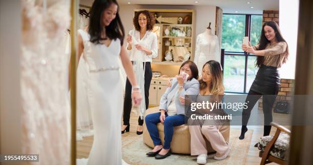 mother and daughter wedding dress shopping - bridal shop stock pictures, royalty-free photos & images