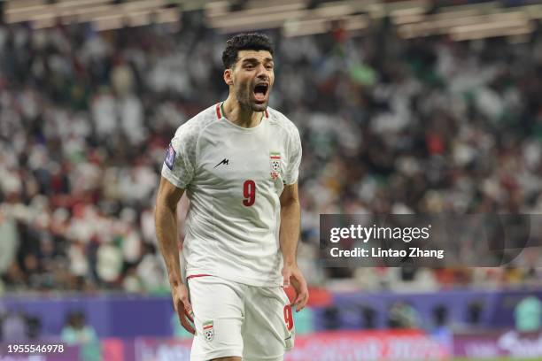 Mehdi Taremi of Iran celebrates scoring his team's second goal during the AFC Asian Cup Group C match between Iran and United Arab Emirates at...