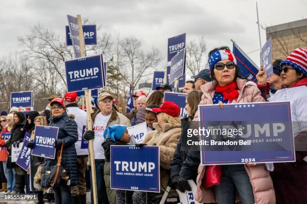 Trump supporters wait together ahead of Republican presidential candidate and former President Donald Trump's visit to the Londonderry High School...