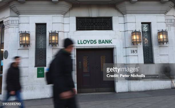 People walk past a branch of Lloyds Bank on Baker street on January 26, 2024 in London, England. This week, Lloyds Banking Group, which also owns...