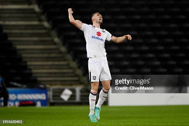 Warren O'Hora of MK Dons celebrates scoring his team's third goal during the Sky Bet League Two match between Milton Keynes Dons and AFC Wimbledon at...