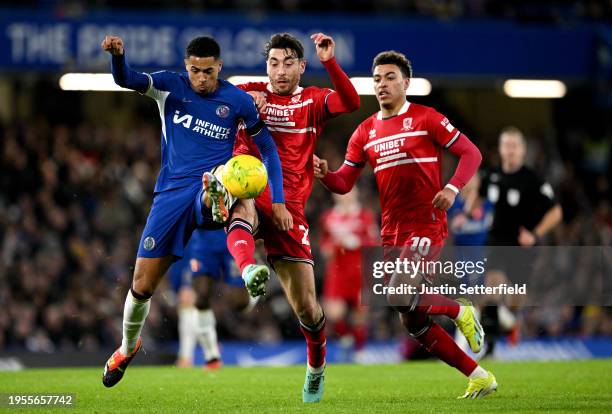 Levi Colwill of Chelsea battles for possession with Matt Crooks of Middlesbrough during the Carabao Cup Semi Final Second Leg match between Chelsea...