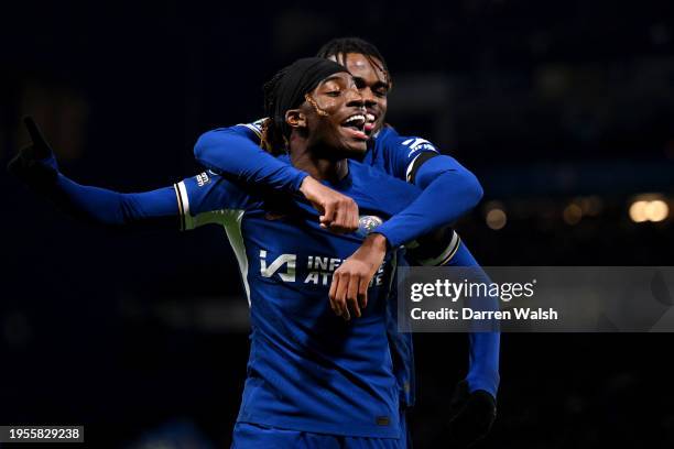 Noni Madueke of Chelsea celebrates scoring his team's sixth goal with teammate Carney Chukwuemeka during the Carabao Cup Semi Final Second Leg match...