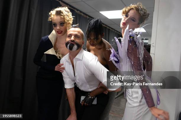 Designer Julien Fournié poses with models backstage prior to the Julien Fournié Haute Couture Spring/Summer 2024 show as part of Paris Fashion Week...