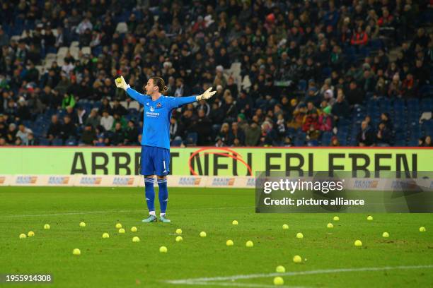 January 2024, Lower Saxony, Hanover: Soccer: Bundesliga 2, Hannover 96 - 1. FC Nürnberg, Matchday 19, Heinz von Heiden-Arena. Fans throw tennis balls...