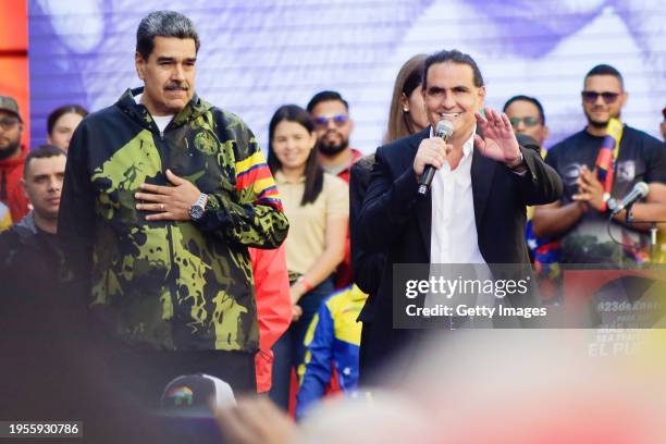 President of Venezuela Nicolas Maduro gestures as President of Venezuela's International Center for Productive Investment Alex Saab speaks during a...