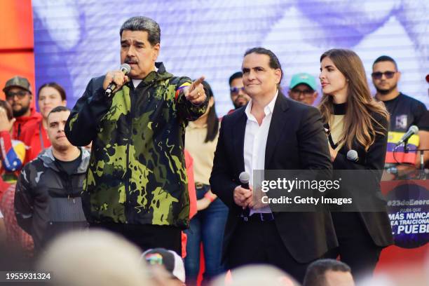 President of Venezuela Nicolas Maduro speaks next to the President of Venezuela's International Center for Productive Investment Alex Saab during a...
