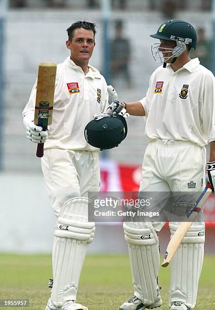 Jacques Rudolph celebrates his 200 with Boeta Dippenaar of South Africa during the 3rd day of the first test match between South Africa and...
