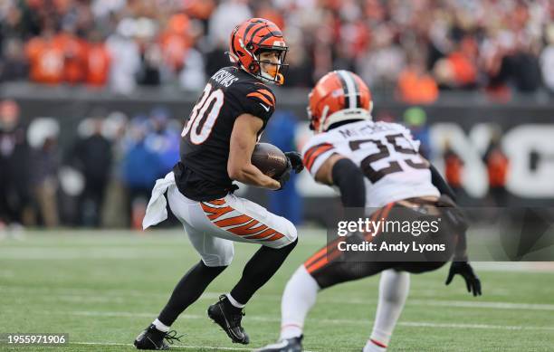 Andrei Iosivas of the Cincinnati Bengals runs with the ball against the Cleveland Browns at Paycor Stadium on January 07, 2024 in Cincinnati, Ohio.