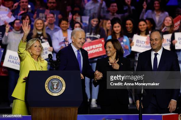 First lady Jilly biden, U.S. President Joe Biden, U.S. Vice President Kamala Harris and Second gentleman Douglas Emhoff join hands as they depart a...