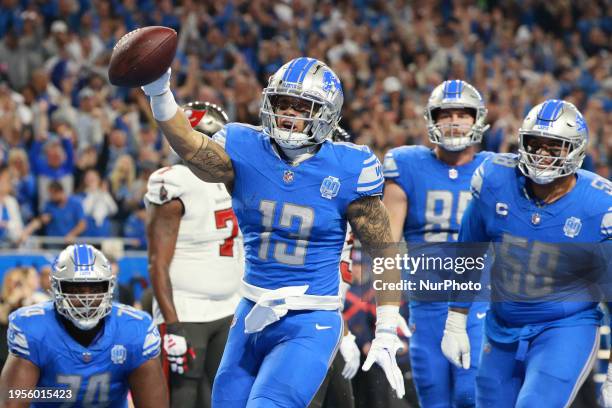 Detroit Lions running back Craig Reynolds celebrates after scoring a touchdown during the second half of the NFC Divisional Round Playoffs between...