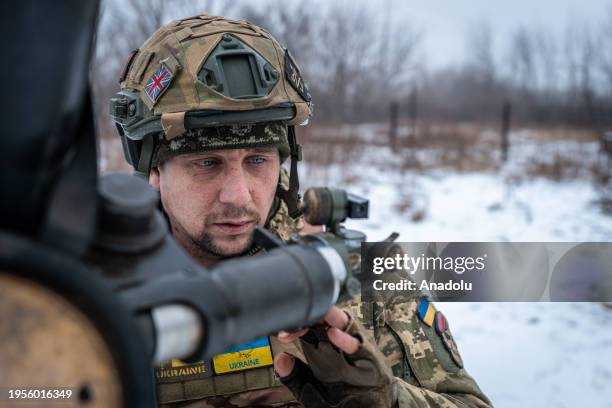 Ukrainian soldier prepares a mortar before shooting a target in the direction of Bakhmut, where clashes between Russia and Ukraine continue to take...