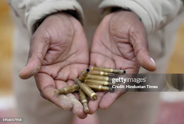 Police personnel picking up the used cartridges after celebratory firing during Republic Day Parade at Surajpur police line, on January 26, 2024 in...