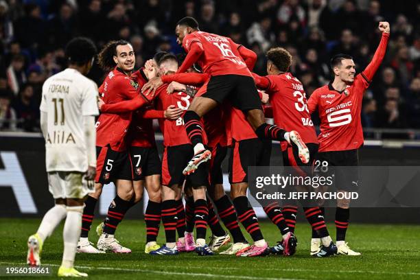 Rennes' players celebrate team's third goal during the French L1 football match between Olympique Lyonnais and Stade Rennais at the Groupama Stadium...