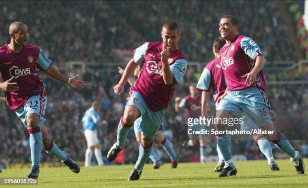 October 16: Luke Moore of Aston Villa, Kevin Phillips of Aston Villa and Wilfred Bouma of Aston Villa celebrate during the Premier League match...