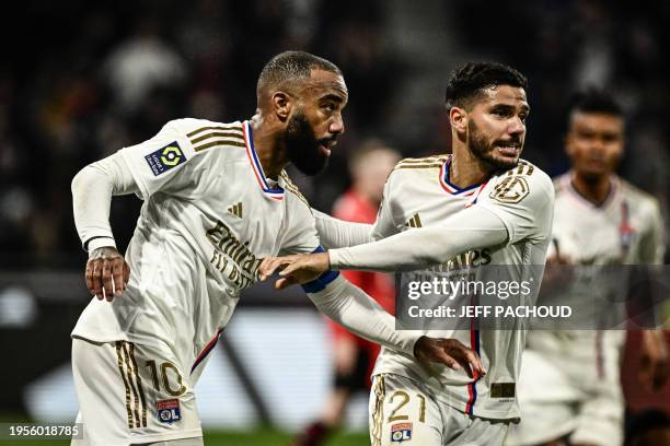 Lyon's French forward Alexandre Lacazette celebrates after scoring a goal during the French L1 football match between Olympique Lyonnais and Stade...