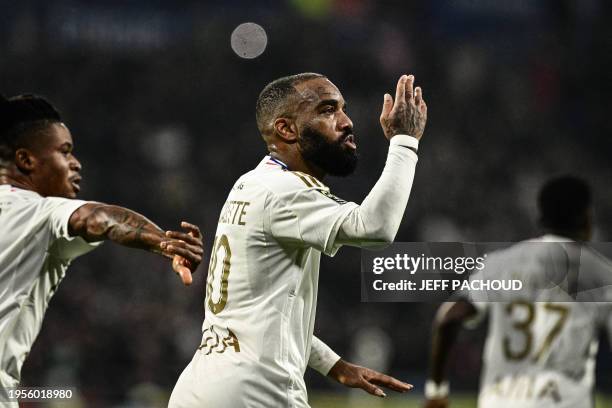 Lyon's French forward Alexandre Lacazette celebrates after scoring a goal during the French L1 football match between Olympique Lyonnais and Stade...