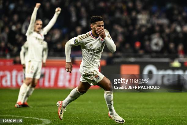 Lyon's Brazilian defender Henrique Silva Milagres celebrates after scoring a goal during the French L1 football match between Olympique Lyonnais and...